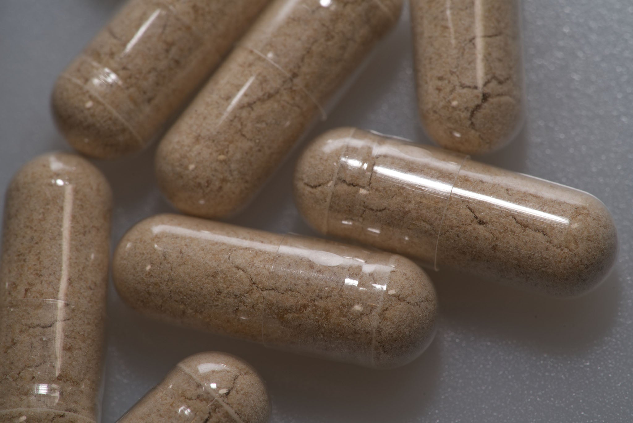 Close Up On Several Capsules Containing full spectrum dry powder after being independently tested for purity